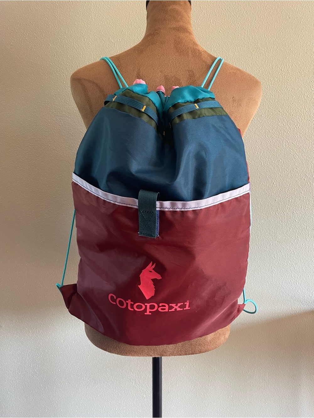 cotopaxi Colorblock Drawstring Backpack - Teal, Navy & Burgundy with Pink Logo